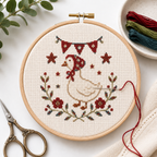 Star-Spangled Goose Mini cross stitch pattern stitched in a hoop mockup by Calico & Clove