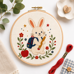 Completed School Bunny Mini cross stitch pattern shown stitched in a hoop with floss styling by Calico & Clove