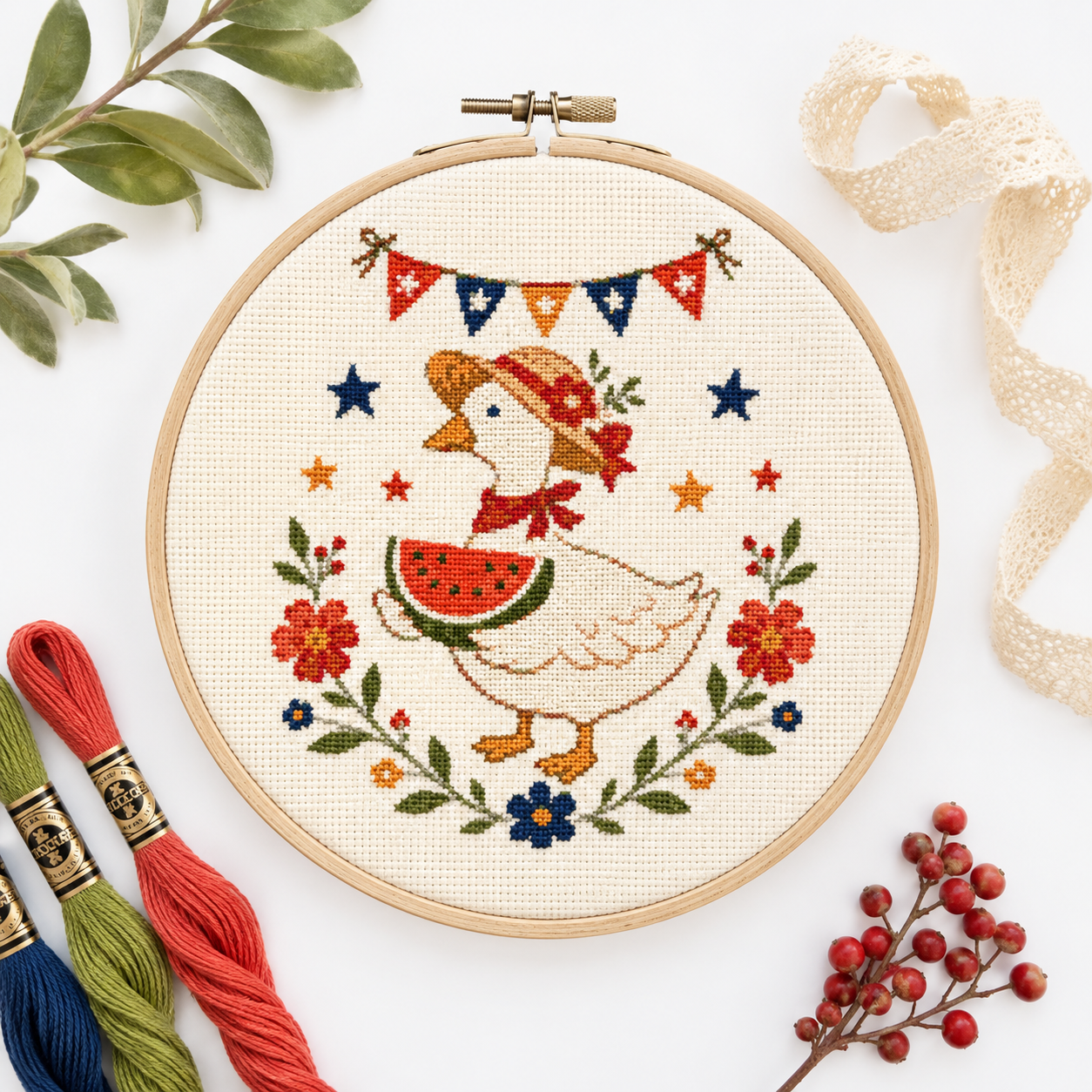Completed Summer Picnic Goose Mini cross stitch pattern shown stitched in a hoop with floss styling by Calico & Clove