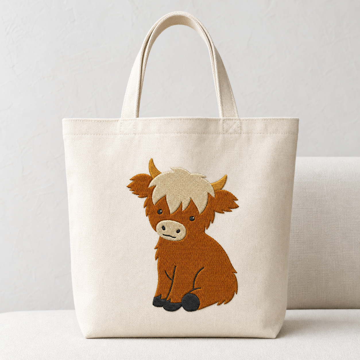 Meadow Baby Highland Cow machine embroidery design on tote